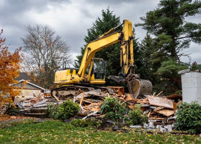 Excavator,Completing,Demolition,Of,A,House,For,Residential,Re-development,,Large